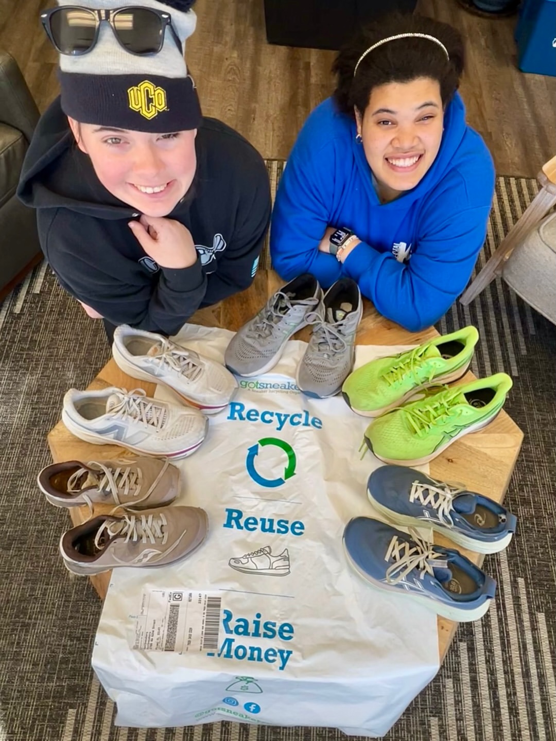 Two friends with a filled GotSneakers bag and sneakers ready to ship