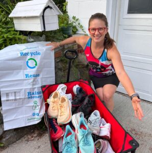 Runner with a wagon full of retired running shoes next to a GotSneakers collection bag